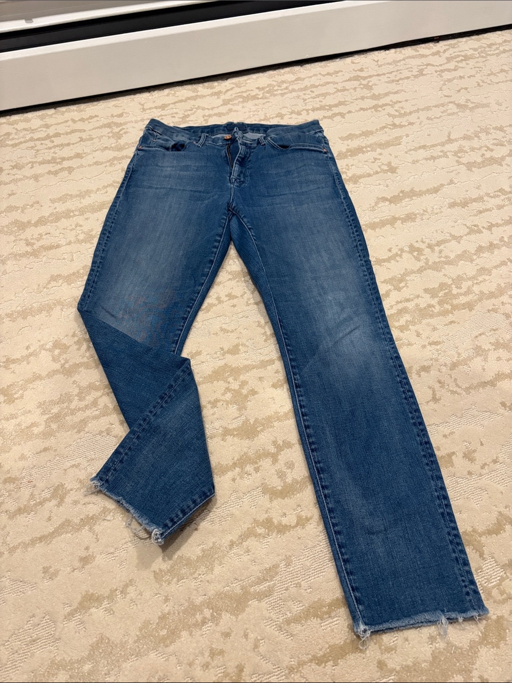 Mother “high waisted looker ankle fray”